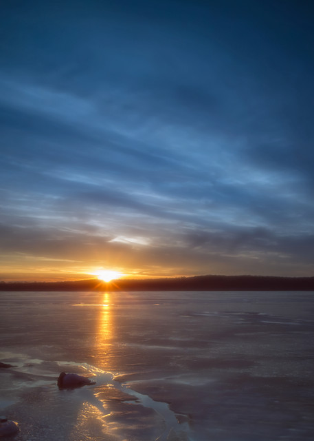 Stockton lake, frozen on a February afternoon, at sunset on a beautiful winter day.