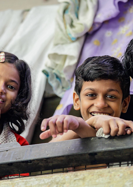 Three children having fun for the photographer in India | Nicki Geigert