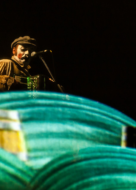 Maryn Jacques of the Tiger Lillies plays the piano accordion behind a scrim at the Celebrate Brooklyn concert. The Tiger Lillies performed their song cycle based on Coleridge's "Rime of the Ancient Mariner".