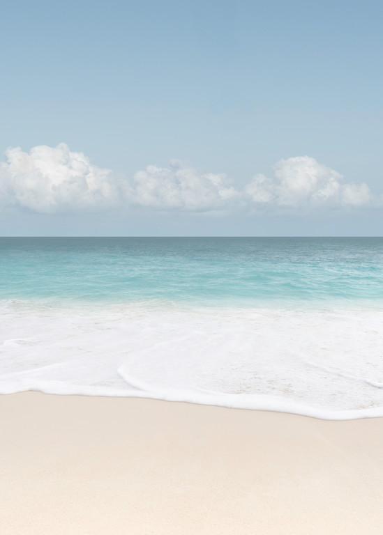 A fine art seascape photograph of water foam on the sand in Anguilla by Mia DelCasino.