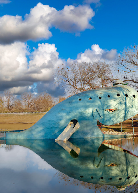 The smiling Blue Whale of Catoosa, in the small Oklahoma city of the same name , is one of the top attractions named by travelers on historic U.S. Route 66, which runs from Chicago, Illinois, to Santa Monica, California.  Created by Hugh Davis in th