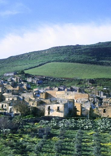 Sicilian countryside with ruins of 16th century old town Poggioreale in Italy. Sicily (Italian: Sicilia [siˈtʃiːlja]) is the largest island in the Mediterranean Sea; along with surrounding minor islands, it constitutes an autonomous region of Italy,