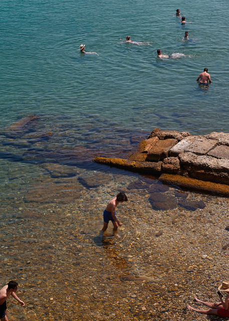 Color photograph of swimmers in Corfu.  