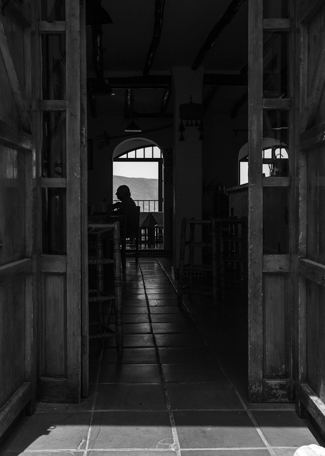 Silhouette of a man sitting in a restaurant