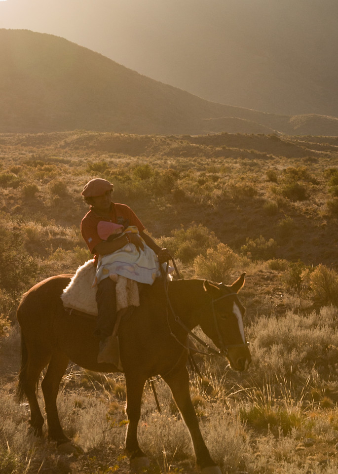 Gaucho on horseback with baby