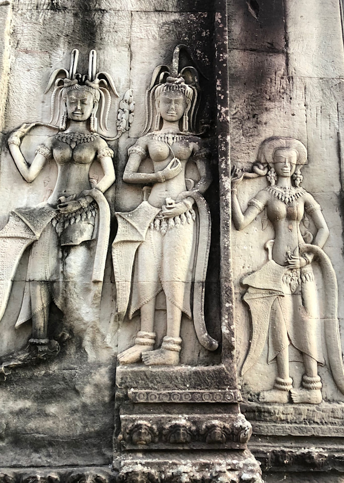 These dancing female divinities (each called an Apsara or Devata) are said to be created for the entertainment of the Hindu gods and as protectors. The walls in Angkor Wat in Siem Reap, Cambodia are filled with approximately 1800 of them. These Khme