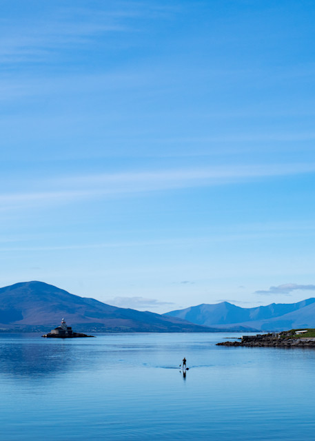 Fine Art Print of a paddle boarder on Tralee bay near the Fenit Lighthouse, County Kerry, Ireland