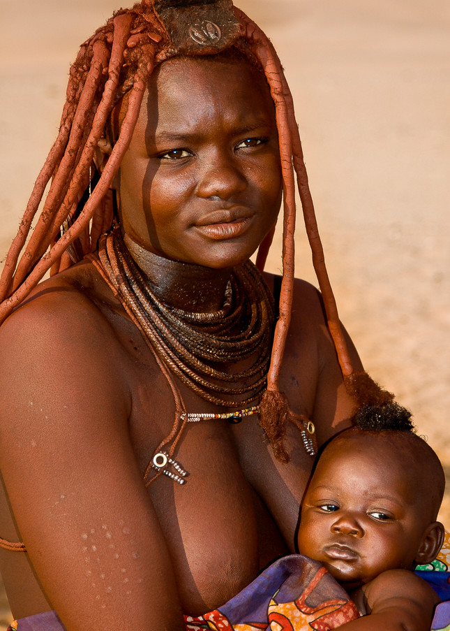 Portrait of Himba woman and baby, Namibia, Africa.