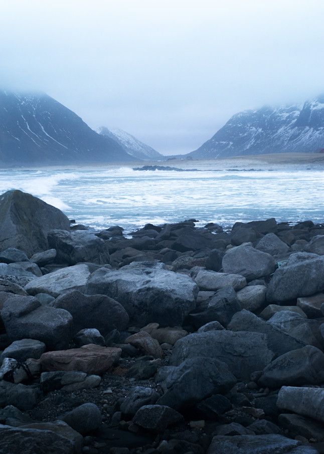 A moody day with turbulent waters and rocky beach of Skagsanden, Lofoten, Nordland, Norway