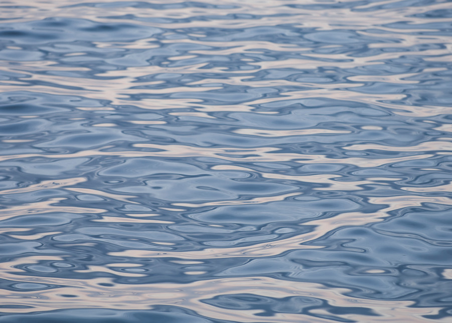 Santa Cruz Island, Channel Islands, California; ripple patterns on the surface of the water reflect the colors in the later afternoon sky