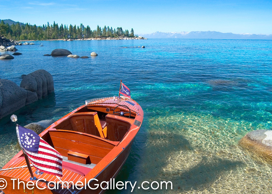 Old wooden boat with american flag at Lake Tahoe