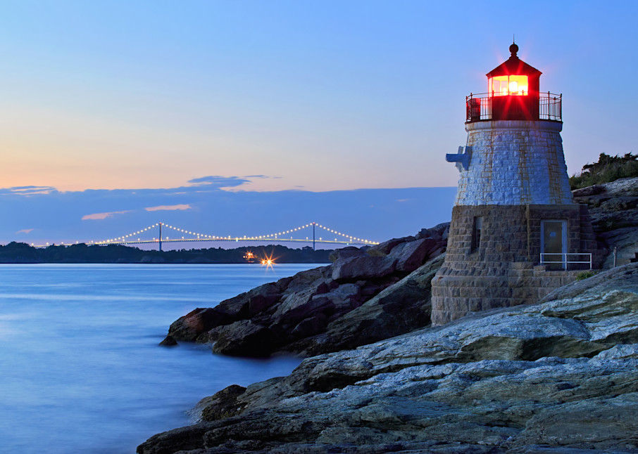 Fine art seascape photograph of the Castle Hill Lighthouse  and Newport Bridge in Newport, Rhode Island, at dusk on a summer evening.