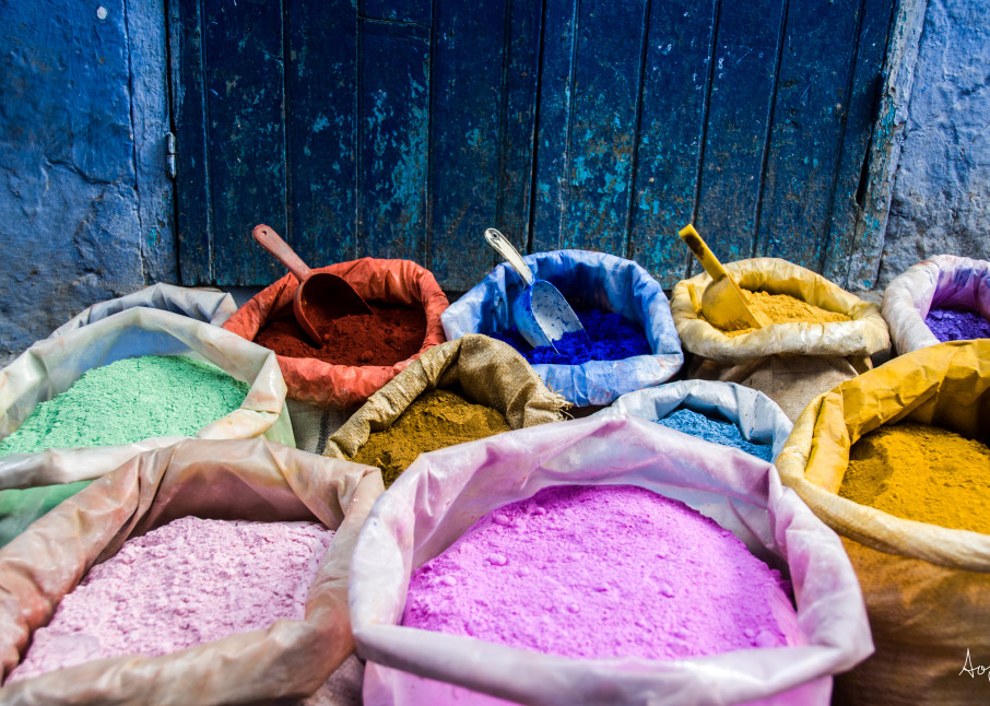 Bags of pigment dyes by blue door and wall  in a fine art photograph print