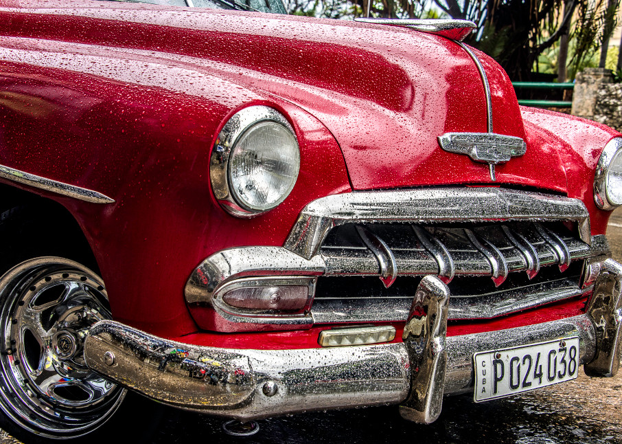 Red 1952 chevy with chrome grille and rain drops