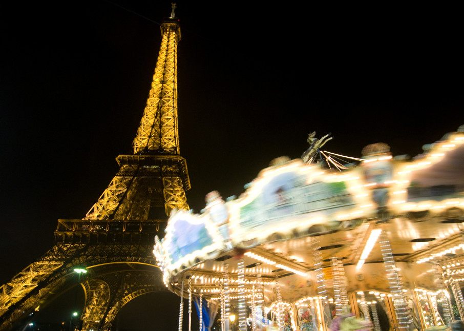 Eiffel tower fine art photograph, at night with spinning carousel in front