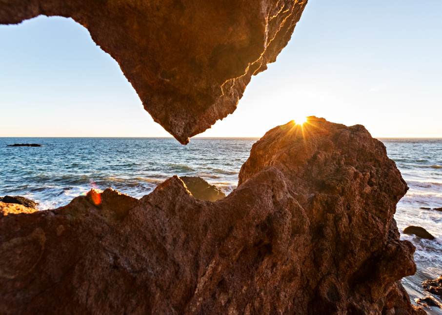 Sun Setting Over Rock At Point Dume Photograph For Sale As Fine Art