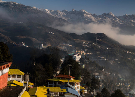Panorama of Tawang with monks playing flutes at sunrise art photograph.