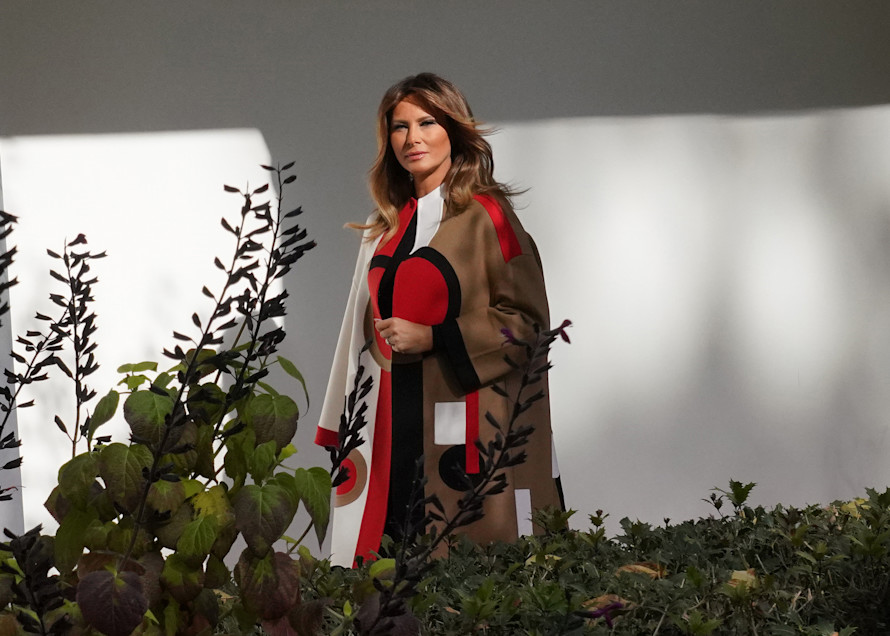 Washington, DC 11/20/18 Melania Trump  wearing Christian Dior coat from the pre-fall 2018 collection walks down the White House colonnade to participate in the Thanksgiving event . Photo by Dennis Brack