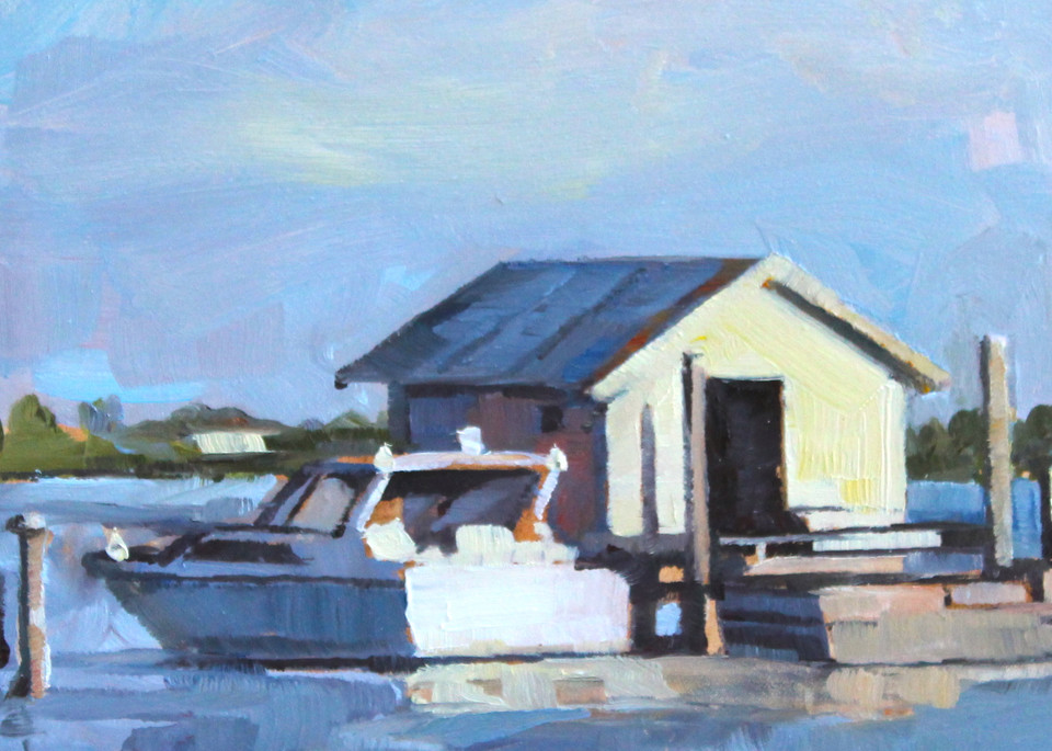 Boat and boathouse in late afternoon Florida