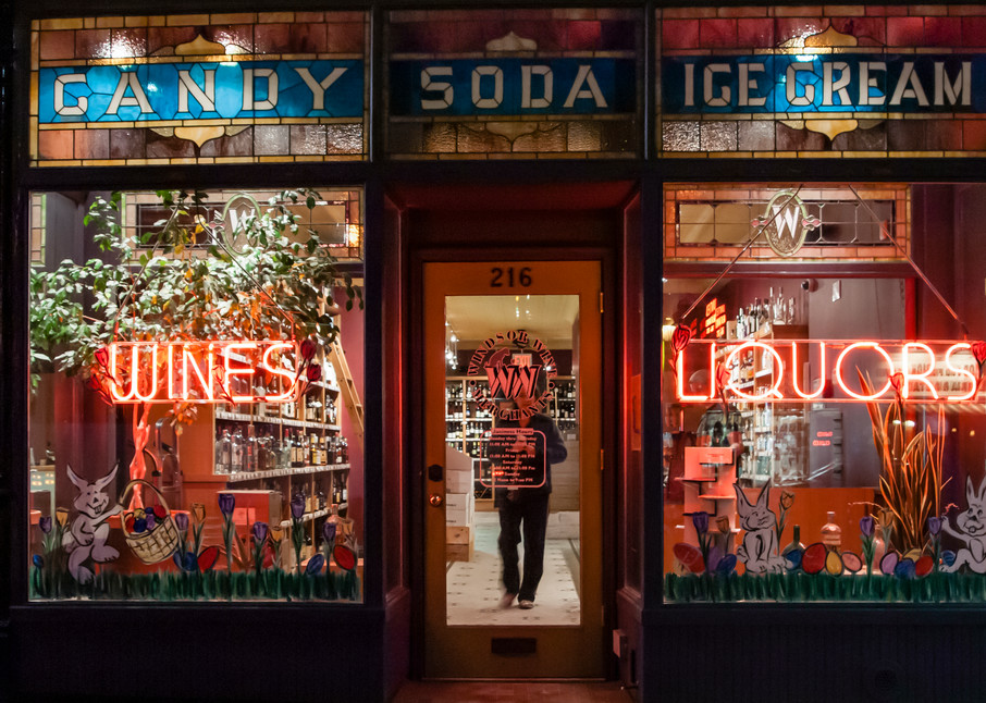 Windsor Wine Merchants, in a former soda shop and candy store, retained the original stained glass widnows advertising candy, soda andicecream.