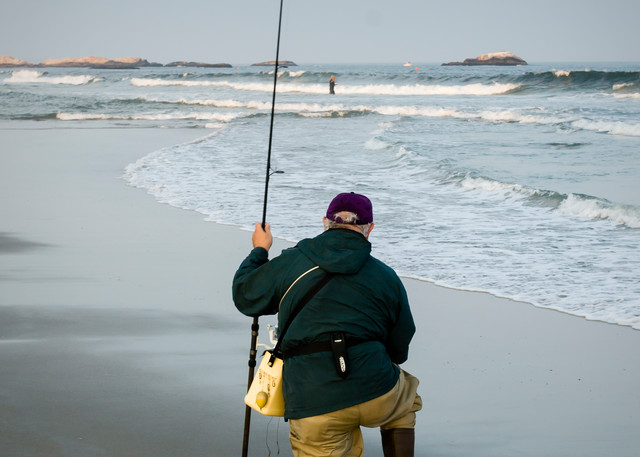 A fisherman on the town beach at Narragansett, Rhode Island.