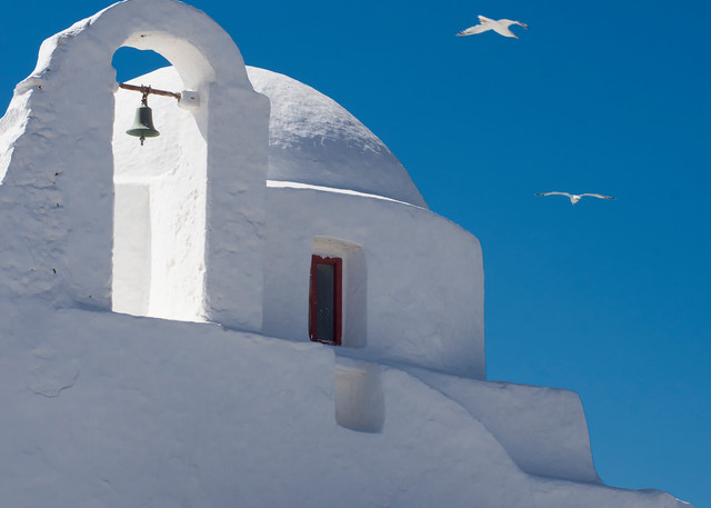 White church with dome ion Mykonos, Greece