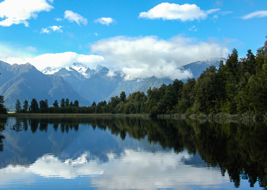 Stunning mountains and blue sky reflected in calm waters of New Zealand | Nicki Geigert Photographer
