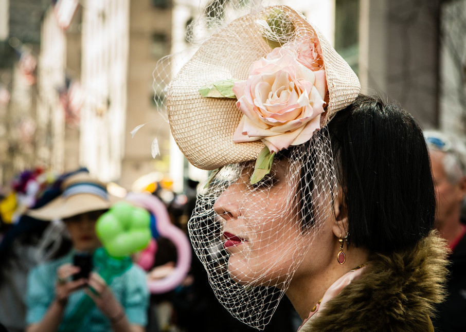 New York, NY - 8 April 2012. A woman in a hat and veil reminiscent of the 1940s in New York City's Easter Parade and Bonnet Festival on Fifth Avenue.