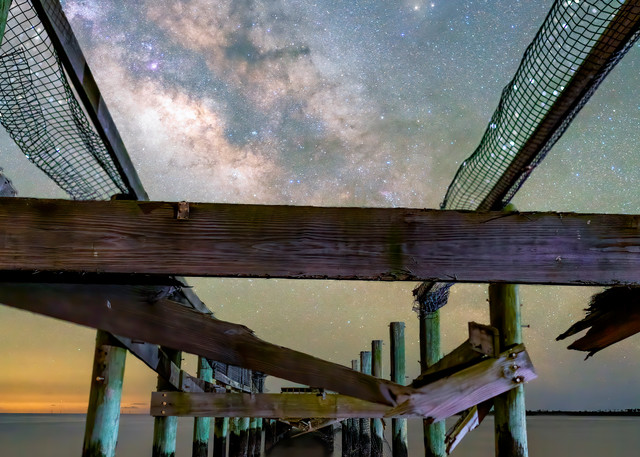 Ruins of hurricane damaged the fishing dock under Milky Way in Coastal Florida