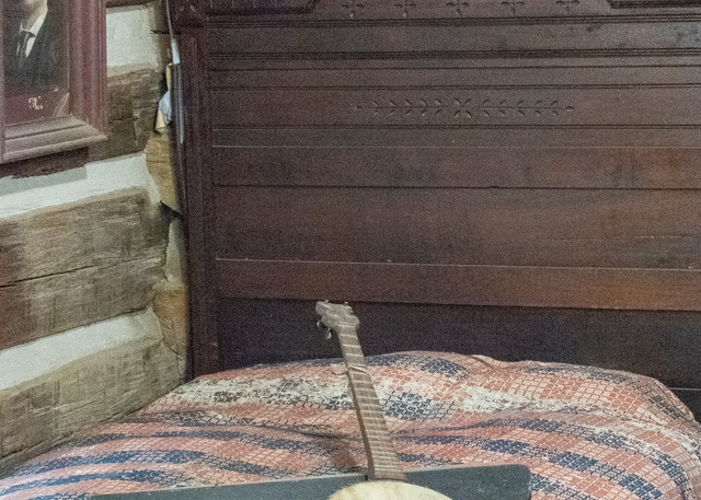 Banjo On Bed In Log Cabin Photography Art | Great Wildlife Photos, LLC
