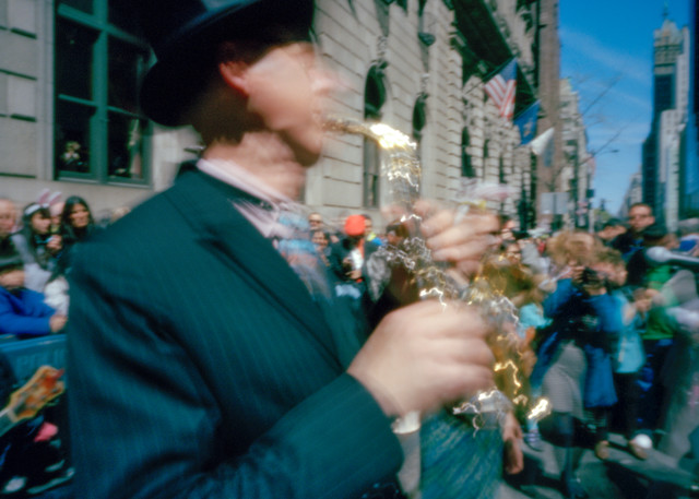 New York, NY - 20 April 2014. A musician plays swing on a sopranino saxophone in the Easter Parade and Bonnet Festival.