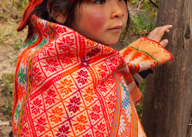 Child in colorful traditional dress in Peru | Nicki Geigert