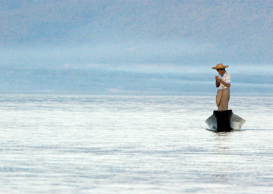 Fisherman smoke Inle Lake Myanmar Burma blue