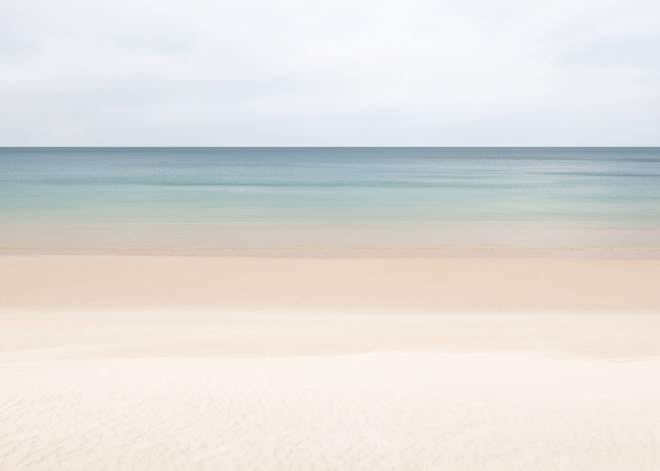 A minimalist photograph of bands of color on the beach in Ireland.