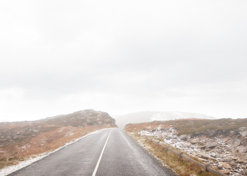 A minimalist fine art photograph of a snowy road in Ireland by Mia DelCasino