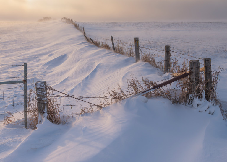 Old Rugged Fence In Drifting Snow