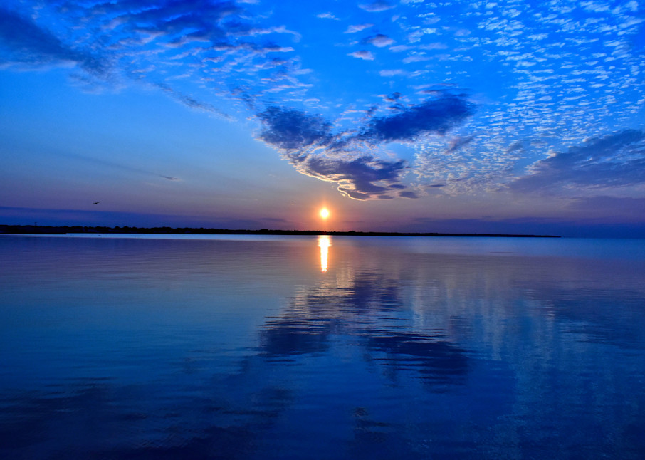 Serene blue sunrise and cloudscape