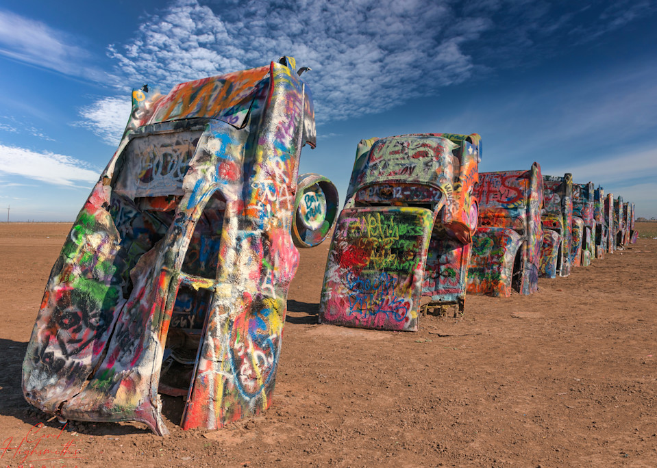 Robert Griffin is no spray-painting vandal.  Like thousands of other visitors to the "Cadillac Ranch" along Old U.S. Route 66 outside Amarillo, Texas, he is encouraged to bring a along a spray can to add a touch or two to the unusual public art inst