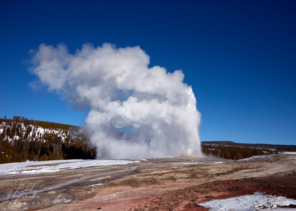 The Old Faithful geyser faithfully erupts in the Wyoming portion of Yellowstone National Park, which makes up the lion's share of the nation's first national park.  Small pieces of the park also spill into neighboring Idaho and Montana.  Old Faithfu