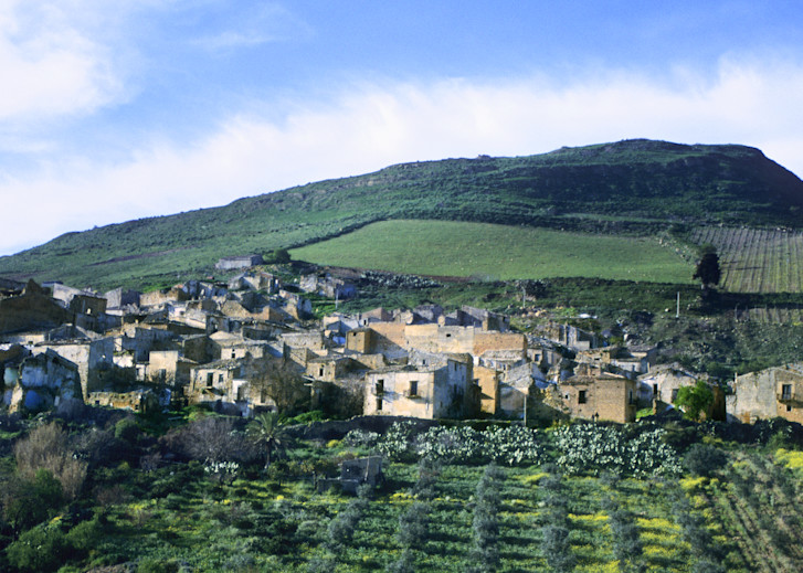 Sicilian countryside with ruins of 16th century old town Poggioreale in Italy. Sicily (Italian: Sicilia [siˈtʃiːlja]) is the largest island in the Mediterranean Sea; along with surrounding minor islands, it constitutes an autonomous region of Italy,