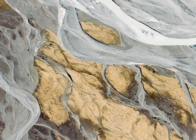 An abstract aerial photograph of the glacial rivers of New Zealand by fine art travel photographer Allison Davis