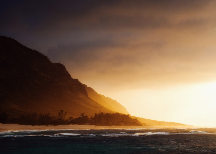 The North shore of Oahu Hawaii as the sunlight comes through a storm by fine art photographer Allison Davis