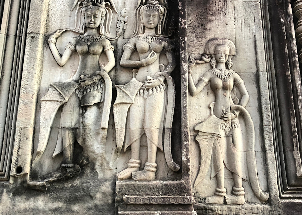 These dancing female divinities (each called an Apsara or Devata) are said to be created for the entertainment of the Hindu gods and as protectors. The walls in Angkor Wat in Siem Reap, Cambodia are filled with approximately 1800 of them. These Khme