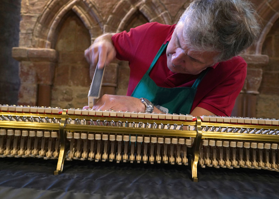 A piano tuner tunes a Steinway piano in the Magnus Cathedral in Kirkwall Scotland
Every Steinay has it’s own soul.  The great piano tuners first listen.  The piano tells the tuner what is needed.  Most often the tuning  involves increase the tensio