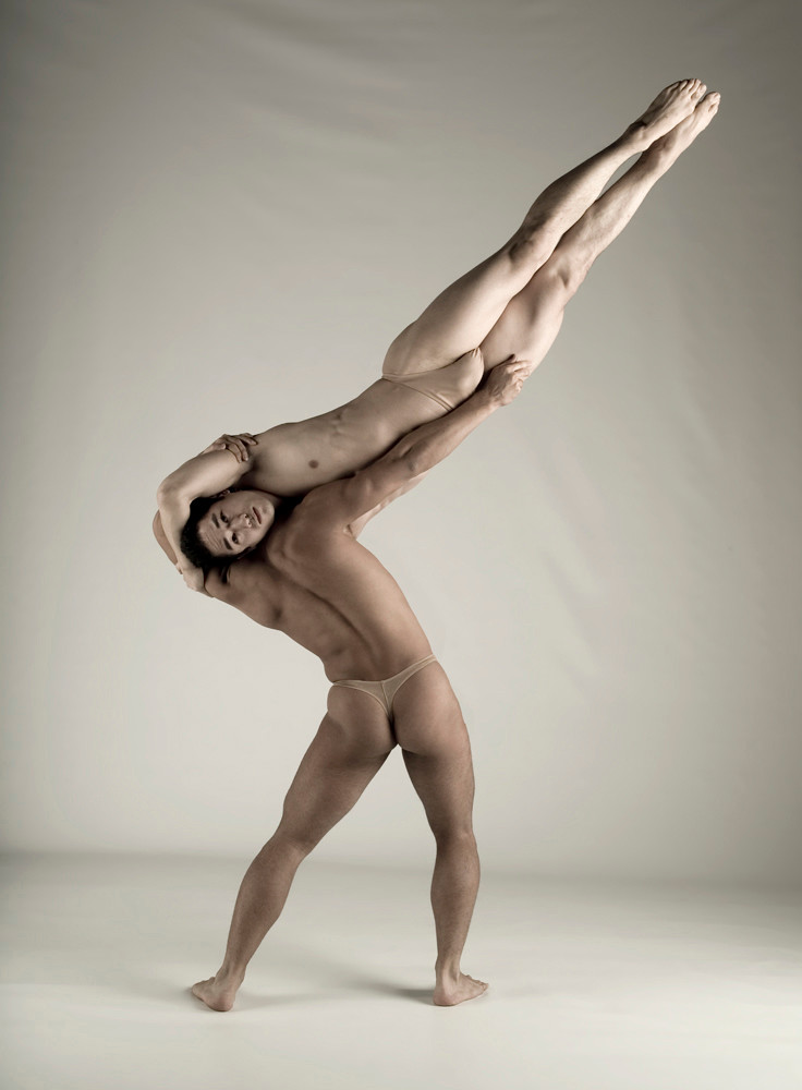 Two Pilobolus dancers in a perpendicular pose. modern dance, naked, nude, m...