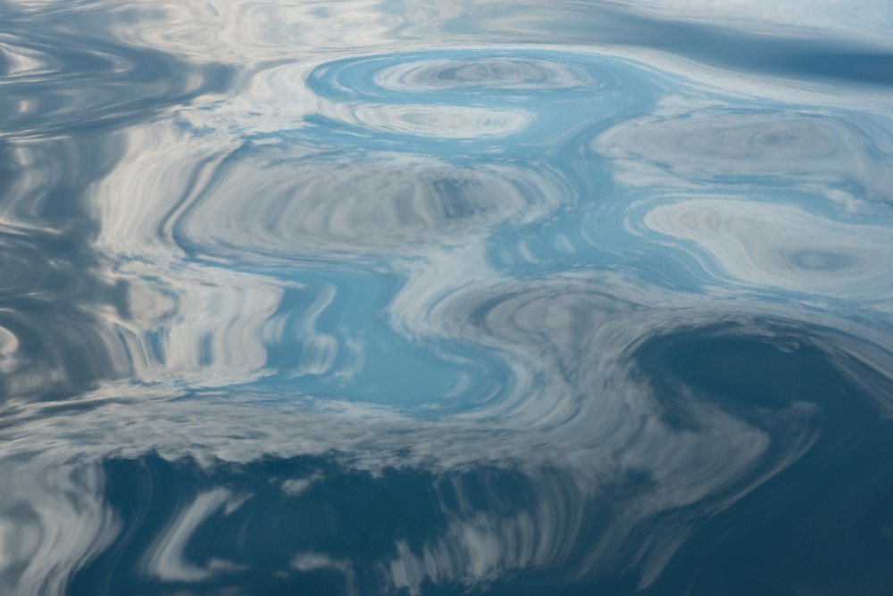 Fine art photo of abstract reflection of cloudson the surface of water by Greg Probst