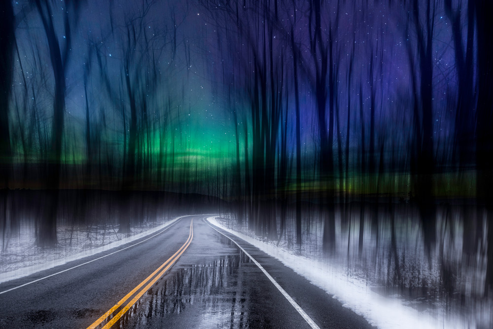 Aurora Road. Surreal fine art creation. Dreamscape of midnight forest amidst brilliant Aurora-colored skies by fine art photographer Mike Taylor of Taylor Photography.