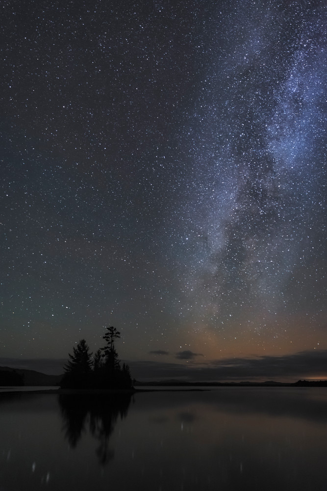 Aurora borealis glowing over Moosehead Lake.