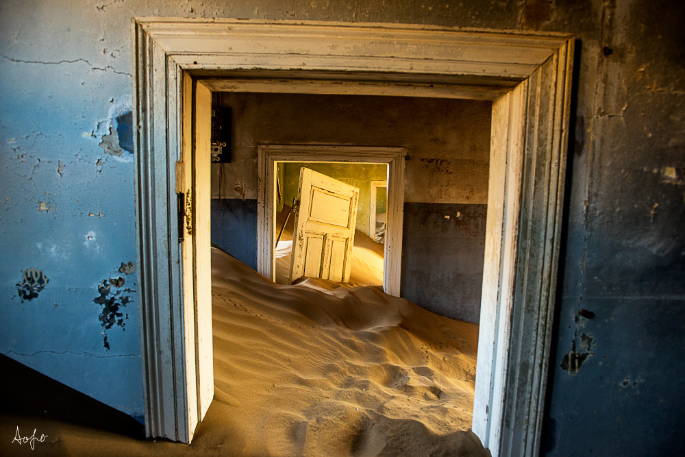 Surreal fine art photograph of desert ghost town house