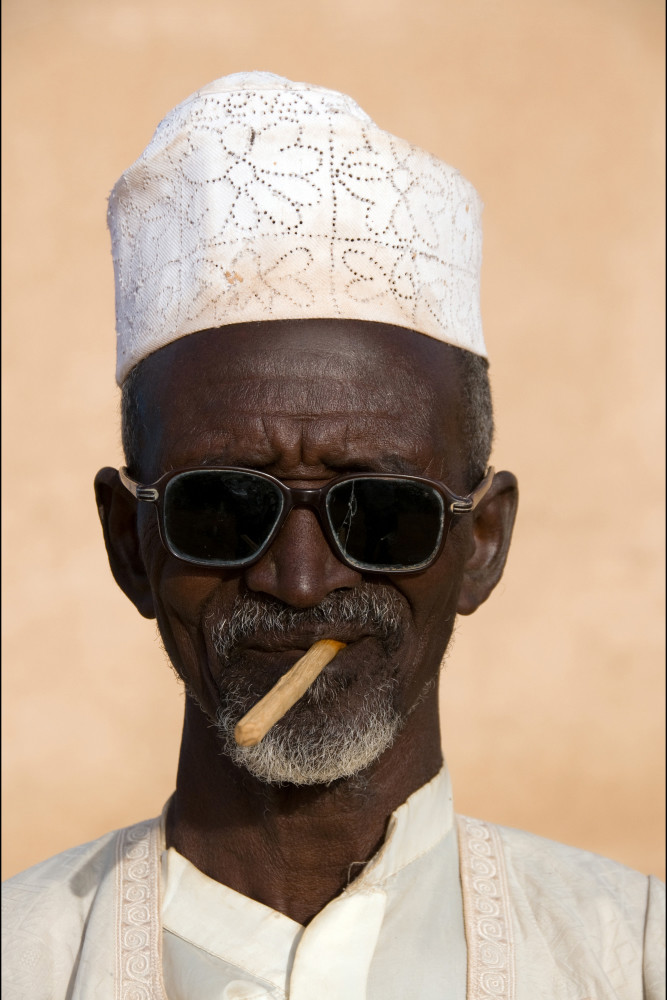 Man Wearing Sunglasses Taking Photos With Smartphone And Selfie Stick Stock  Photo - Download Image Now - iStock